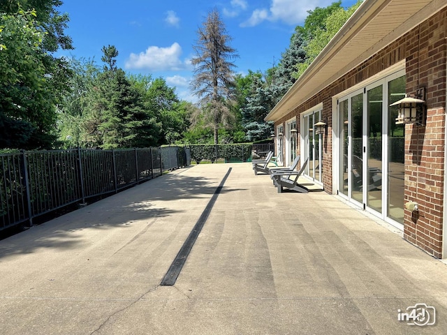 614 Pineridge Dr N Unit 614, Oswego, IL 60543 - view of patio / terrace featuring view of wooded area