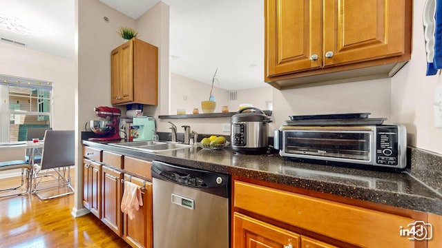 614 Pineridge Dr N Unit 614, Oswego, IL 60543 - kitchen with dishwasher, wood finished floors, and brown cabinets