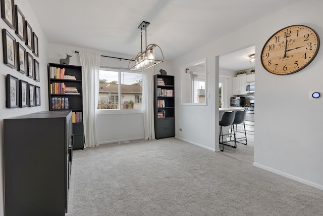 1669 W Bayside Ct, Hoffman Estates, IL 60192 - dining area with light colored carpet and a chandelier