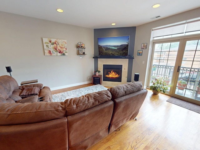 4968 N Milwaukee Ave Unit 2W, Chicago, IL 60630 - living area with wood finished floors, a tile fireplace, and recessed lighting
