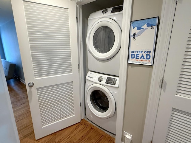 4968 N Milwaukee Ave Unit 2W, Chicago, IL 60630 - laundry area featuring stacked washer and clothes dryer and wood finished floors