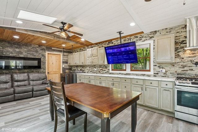 30 Aspen Ln, Wilmington, IL 60481 - kitchen featuring gas range, a wooden ceiling with exposed beams, decorative backsplash, light wood finished floors, and ceiling fan