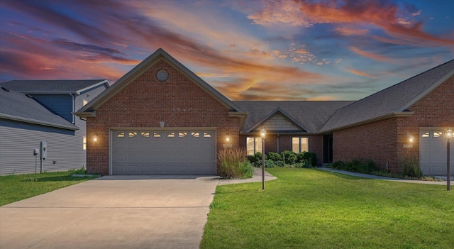 4537 Nicklaus Dr, Champaign, IL 61822 - traditional-style home with brick siding, an attached garage, a front yard, and concrete driveway