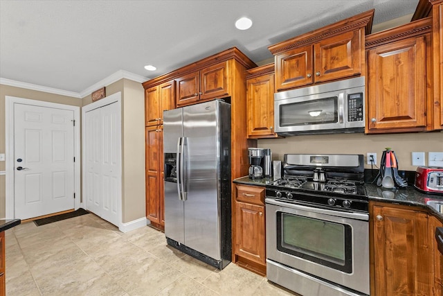 4537 Nicklaus Dr, Champaign, IL 61822 - kitchen featuring appliances with stainless steel finishes, ornamental molding, brown cabinetry, dark stone counters, and recessed lighting