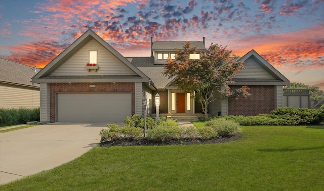 2405 Prairieridge Pl, Champaign, IL 61822 - traditional-style home with brick siding, driveway, a front lawn, and an attached garage