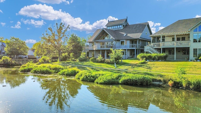 2405 Prairieridge Pl, Champaign, IL 61822 - rear view of house featuring a water view and a lawn