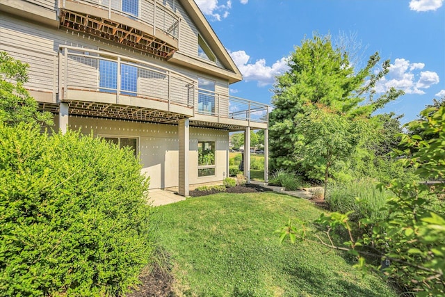 2405 Prairieridge Pl, Champaign, IL 61822 - rear view of house with a balcony and a yard