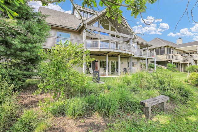 2405 Prairieridge Pl, Champaign, IL 61822 - rear view of house featuring a shingled roof and a deck