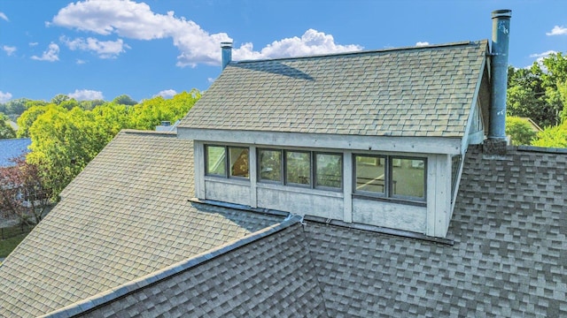 2405 Prairieridge Pl, Champaign, IL 61822 - view of side of property featuring a shingled roof and a chimney