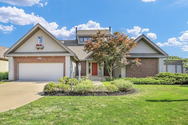 2405 Prairieridge Pl, Champaign, IL 61822 - view of front of home featuring a front lawn, an attached garage, concrete driveway, and brick siding
