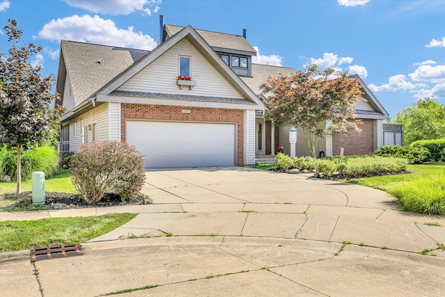 2405 Prairieridge Pl, Champaign, IL 61822 - traditional home with an attached garage, concrete driveway, a shingled roof, and brick siding