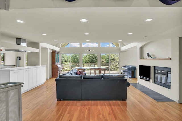 2405 Prairieridge Pl, Champaign, IL 61822 - living area with light wood-type flooring, recessed lighting, and a glass covered fireplace