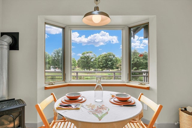 2405 Prairieridge Pl, Champaign, IL 61822 - dining area with a wood stove and baseboards