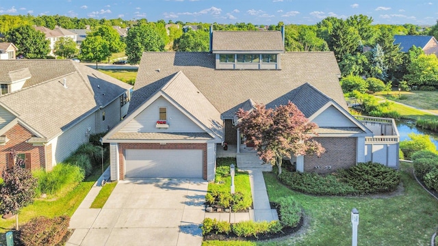 2405 Prairieridge Pl, Champaign, IL 61822 - view of front facade with roof with shingles, driveway, and a garage