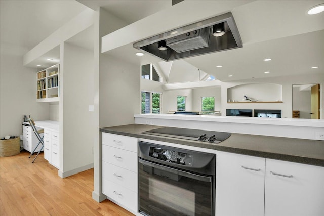 2405 Prairieridge Pl, Champaign, IL 61822 - kitchen with black appliances, extractor fan, dark countertops, white cabinets, and recessed lighting