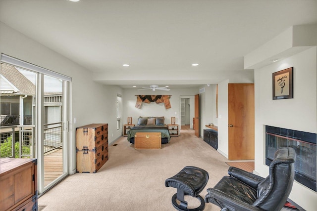 2405 Prairieridge Pl, Champaign, IL 61822 - game room with light carpet, a glass covered fireplace, recessed lighting, and ceiling fan