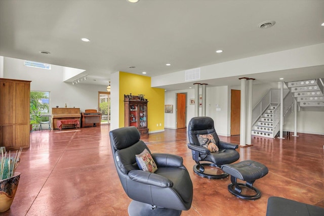 2405 Prairieridge Pl, Champaign, IL 61822 - living room featuring concrete flooring, recessed lighting, and stairway