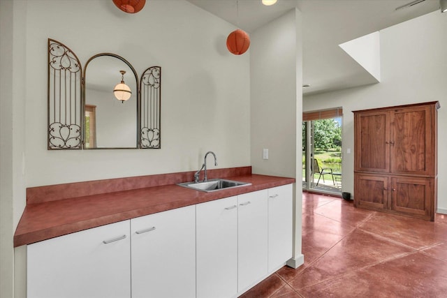 2405 Prairieridge Pl, Champaign, IL 61822 - kitchen featuring white cabinetry and dark countertops