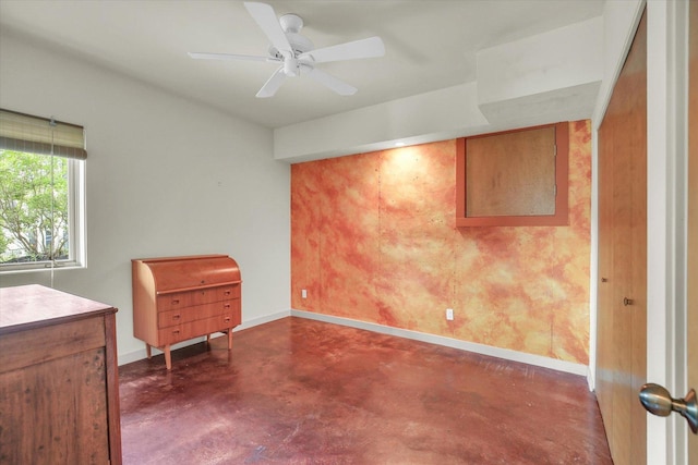 2405 Prairieridge Pl, Champaign, IL 61822 - unfurnished bedroom with finished concrete floors and a ceiling fan