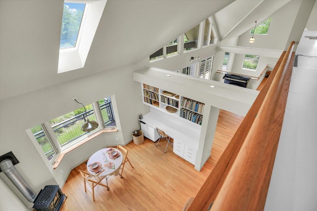 2405 Prairieridge Pl, Champaign, IL 61822 - living room with a high ceiling, a skylight, and wood finished floors
