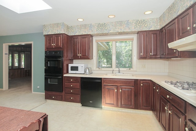 2114 Country Knoll Ln, Elgin, IL 60123 - kitchen featuring black appliances, plenty of natural light, light countertops, tasteful backsplash, and recessed lighting