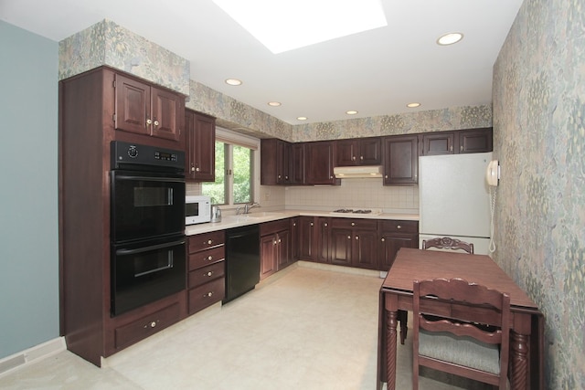 2114 Country Knoll Ln, Elgin, IL 60123 - kitchen with black appliances, under cabinet range hood, dark brown cabinets, light countertops, and light floors