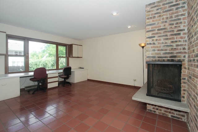 2114 Country Knoll Ln, Elgin, IL 60123 - office featuring dark tile patterned floors, built in desk, a brick fireplace, and recessed lighting