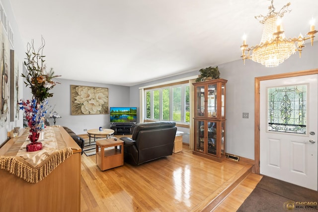 500 S Princeton Ave, Itasca, IL 60143 - living room with a chandelier and light wood-style flooring