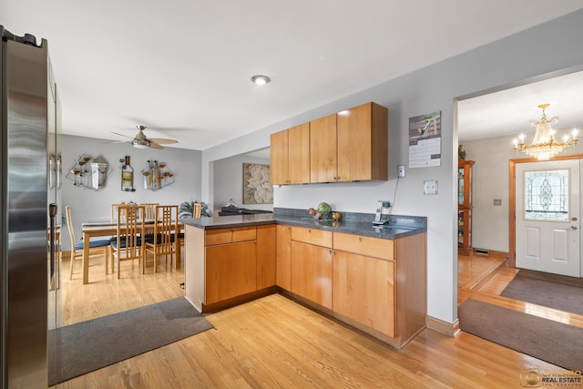 500 S Princeton Ave, Itasca, IL 60143 - kitchen with a peninsula, light wood-style floors, ceiling fan, a chandelier, and stainless steel refrigerator