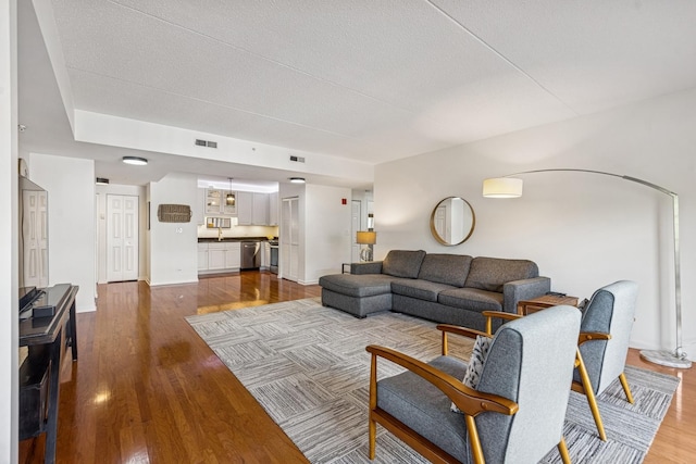 400 Mcdaniels Cir Unit 303, Clarendon Hills, IL 60514 - living room featuring dark wood-type flooring and a textured ceiling
