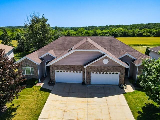 9000 226th Ct Unit 23B, Salem, WI 53168 - ranch-style home featuring concrete driveway, an attached garage, a front yard, and brick siding