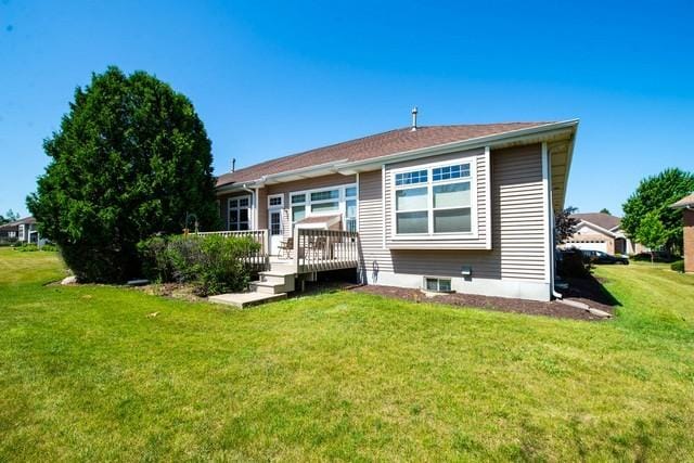 9000 226th Ct Unit 23B, Salem, WI 53168 - rear view of property featuring a wooden deck and a lawn