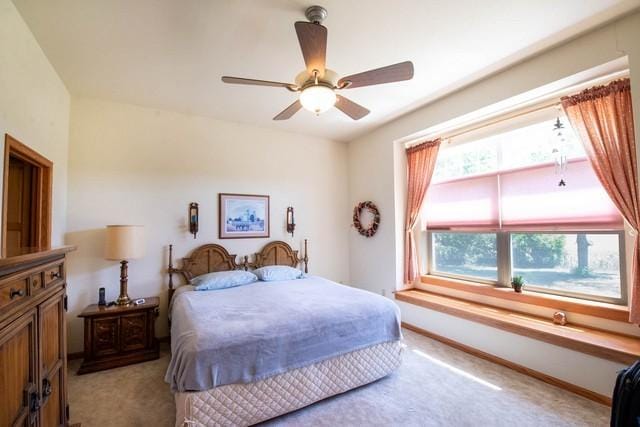 9000 226th Ct Unit 23B, Salem, WI 53168 - bedroom featuring light carpet and ceiling fan
