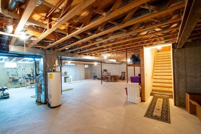 9000 226th Ct Unit 23B, Salem, WI 53168 - unfinished basement with water heater and stairs