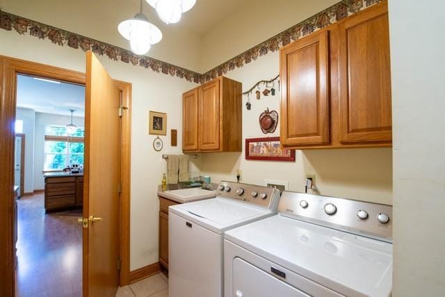 9000 226th Ct Unit 23B, Salem, WI 53168 - washroom featuring cabinet space and washer and clothes dryer