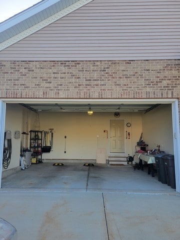 9000 226th Ct Unit 23B, Salem, WI 53168 - garage featuring concrete driveway
