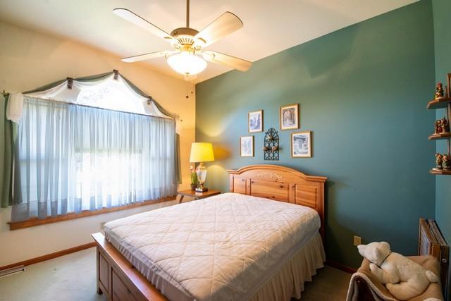 9000 226th Ct Unit 23B, Salem, WI 53168 - bedroom featuring carpet flooring and a ceiling fan