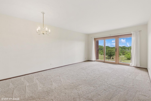 5225 N Riversedge Ter Unit 511, Chicago, IL 60630 - spare room featuring a chandelier and carpet
