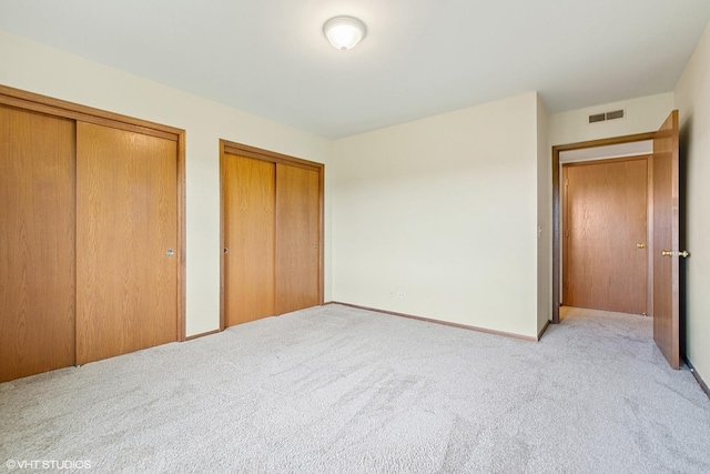 5225 N Riversedge Ter Unit 511, Chicago, IL 60630 - unfurnished bedroom with two closets and light carpet