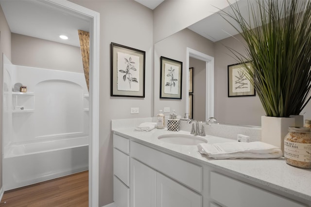 614 Lismore Cir, Elgin, IL 60124 - full bathroom with vanity, wood finished floors, and bathtub / shower combination