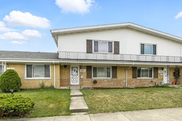 7003 W Carol Ave, Niles, IL 60714 - view of front facade with a front yard, brick siding, and a porch