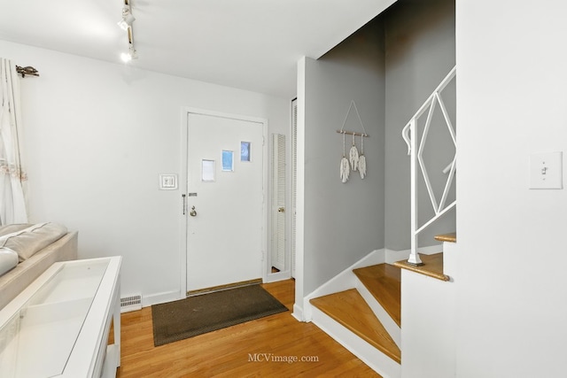 7003 W Carol Ave, Niles, IL 60714 - foyer entrance featuring light wood-style flooring and stairway
