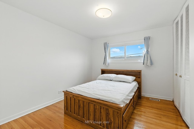7003 W Carol Ave, Niles, IL 60714 - bedroom featuring a closet and light wood finished floors