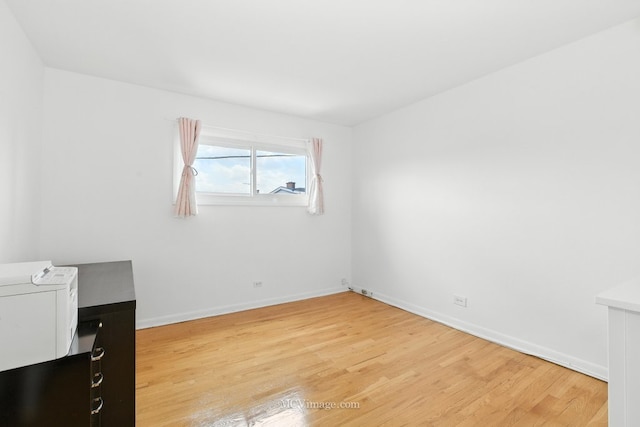 7003 W Carol Ave, Niles, IL 60714 - unfurnished bedroom with light wood finished floors