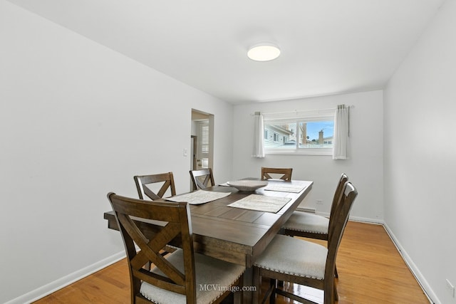7003 W Carol Ave, Niles, IL 60714 - dining space featuring light wood-type flooring and baseboards