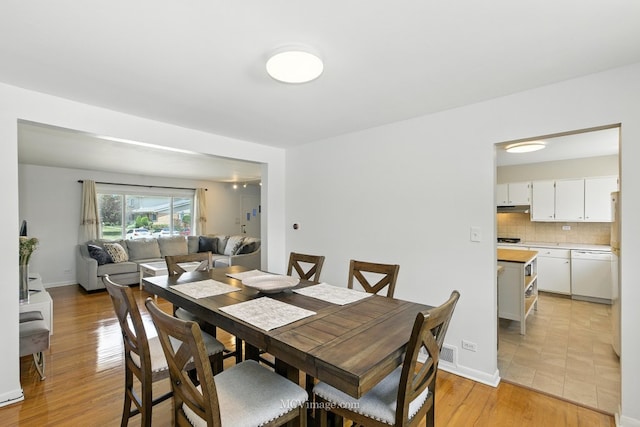 7003 W Carol Ave, Niles, IL 60714 - dining room with light wood finished floors