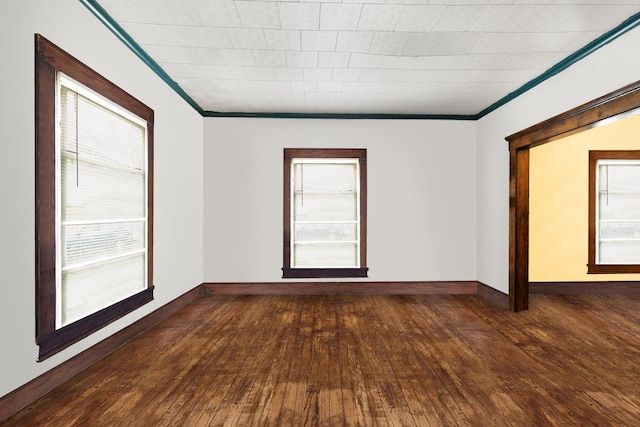 520 Sherman St, Danville, IL 61832 - unfurnished room featuring hardwood / wood-style floors and crown molding