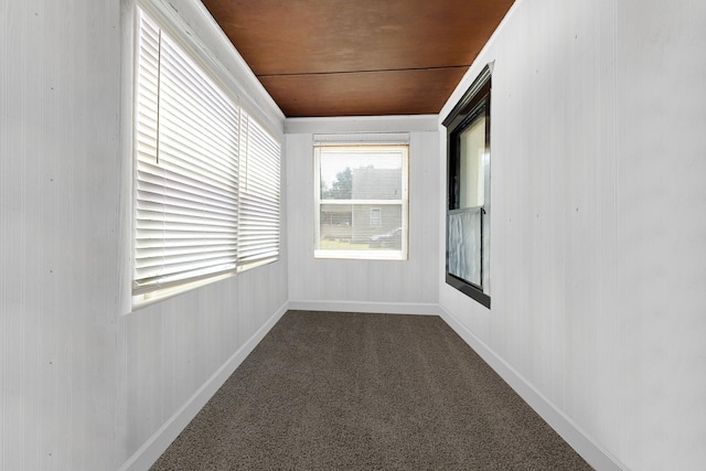 520 Sherman St, Danville, IL 61832 - empty room featuring dark carpet and baseboards