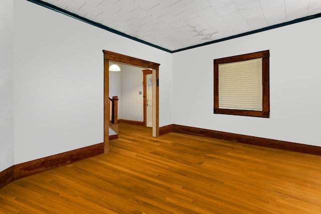 520 Sherman St, Danville, IL 61832 - spare room with hardwood / wood-style floors and crown molding