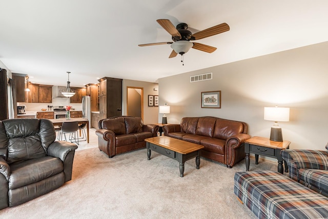 1132 Swanberg Ct, Sycamore, IL 60178 - living room featuring light colored carpet and a ceiling fan
